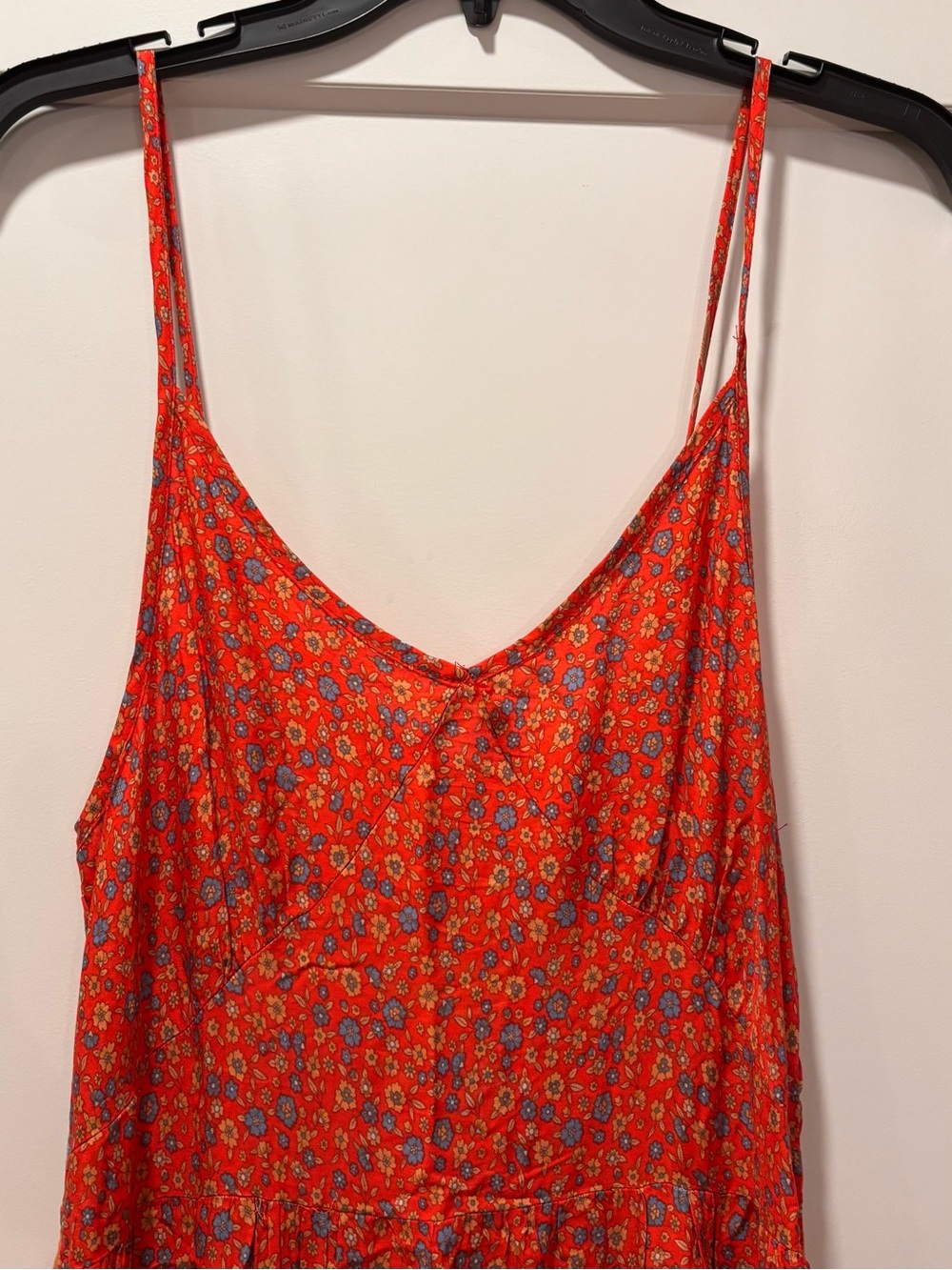 Bohemian style maxi dress featuring a bright red/orange fabric floral print